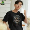 Man wearing a black A Day Without Coffee T Shirt with a full-colour coffee-themed graphic on the front