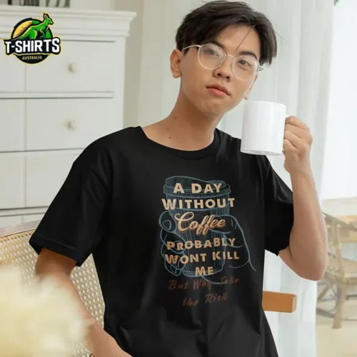 Man wearing a black A Day Without Coffee T Shirt with a full-colour coffee-themed graphic on the front