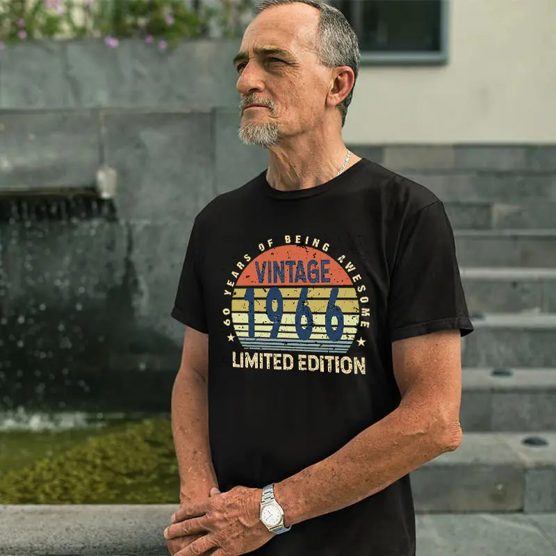 Middle-aged man wearing a black men’s 60th birthday T shirt with “60 Years of Being Awesome” design