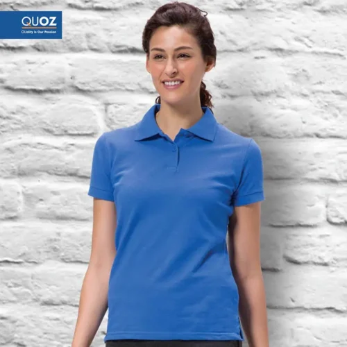 Woman wearing a QUOZ ladies polo shirt in royal blue, classic cotton pique polo suitable for everyday wear