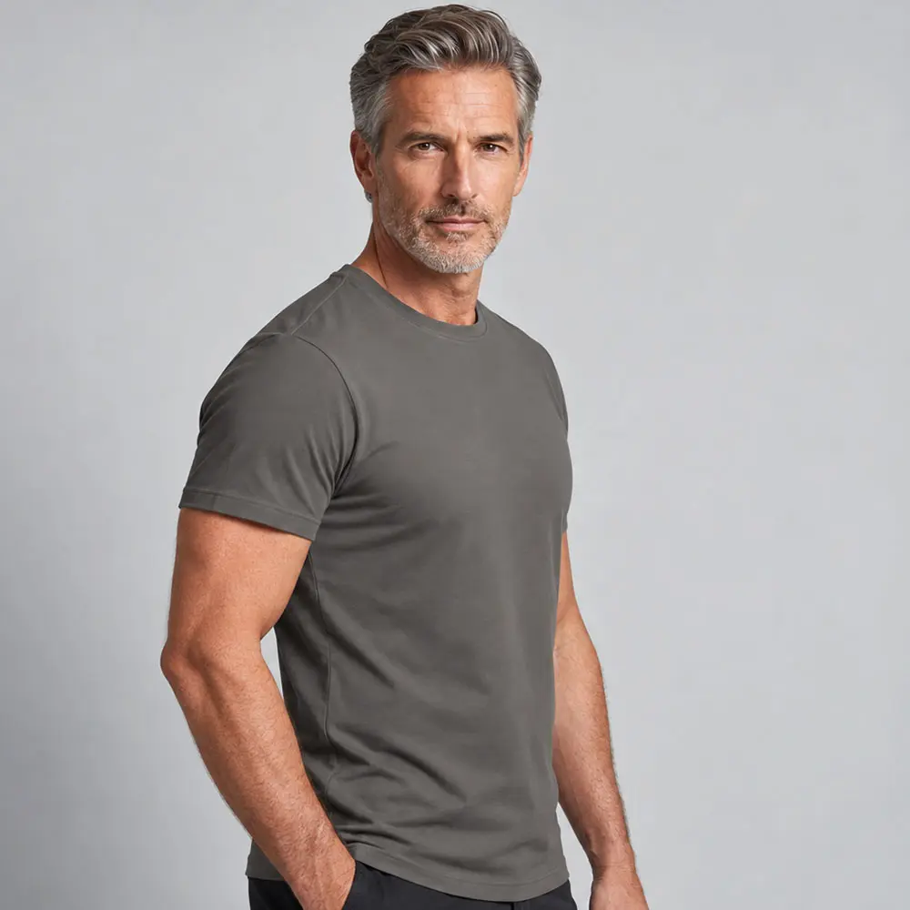 Three-quarter view of a man wearing a Steel Grey Printer 160 T-shirt available for custom printing