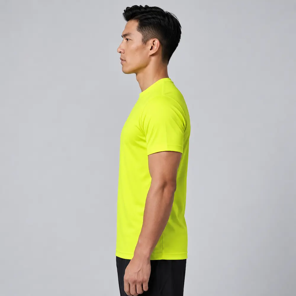 Left-side view of a man wearing the Bright Yellow Printer Activewear PA408 Men’s Run Active Tee.