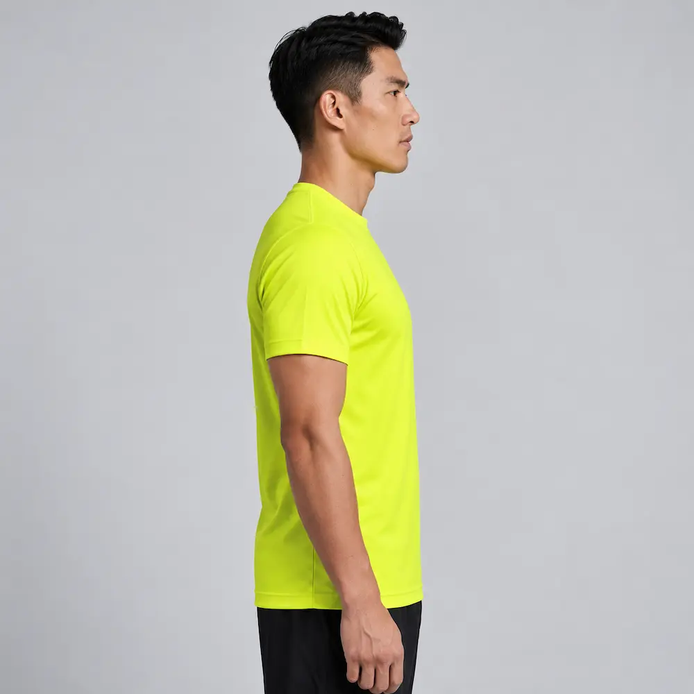 Right-side view of a man wearing the Bright Yellow Printer Activewear PA408 Men’s Run Active Tee.