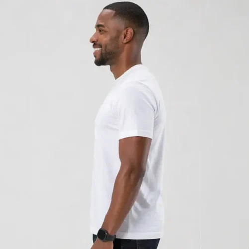 Custom printed bulk white T-shirts side view White unisex T-shirt side profile on model Shows garment fit and sleeve length Clean side seam and structure visible Helps demonstrate overall shape and wearability