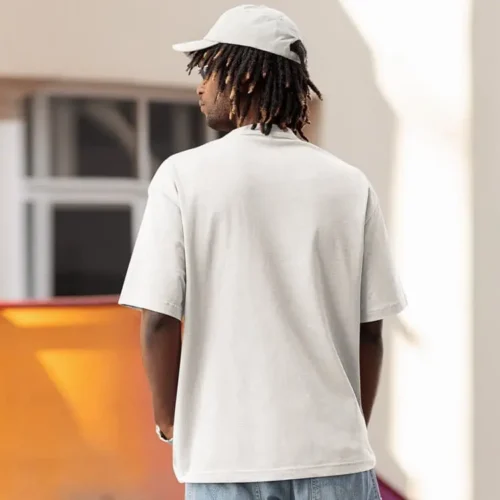 White premium oversized custom tee worn lifestyle back view, oversized fit with dropped shoulders and smooth back panel