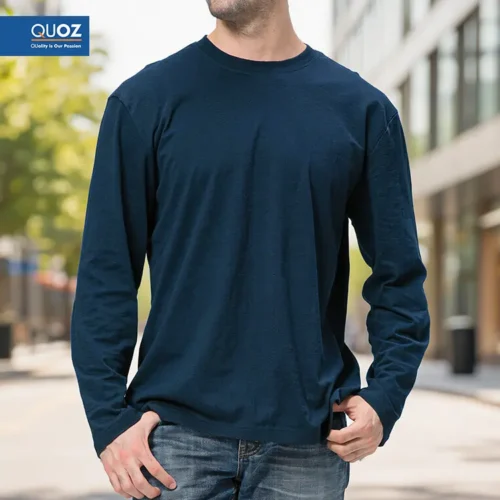 QUOZ Men Long Sleeve Tee in Dark Navy with custom print badge, front view on model