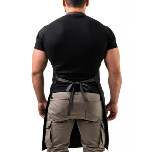 Basic Cotton Canvas Apron in Black, studio back view, person wearing