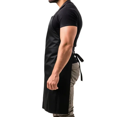 Basic Cotton Canvas Apron in Black, studio side view, person wearing