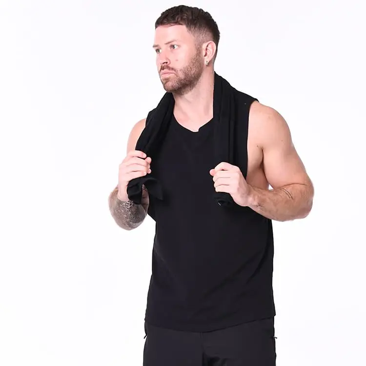 Blank Athletics Essential Gym Towel in Black, studio, towel over shoulder