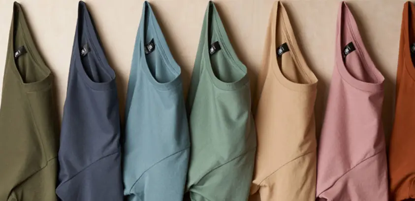 AS Colour t-shirts hanging in earthy tones for custom printing