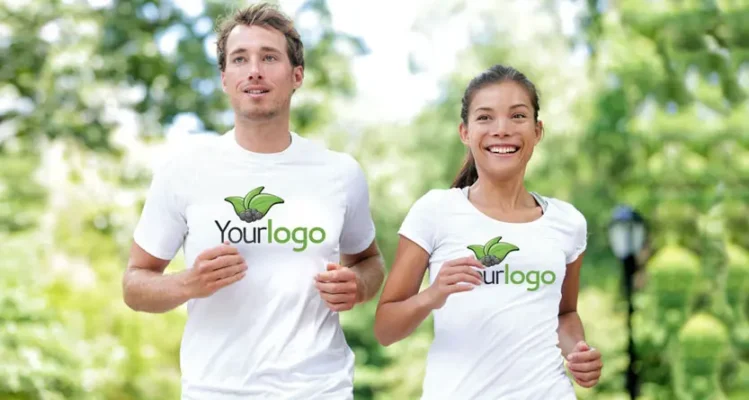 People wearing custom printed white t-shirts with a logo while jogging outdoors