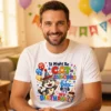 Man wearing a white Cat-astrophe Birthday men’s t-shirt in a party lounge room