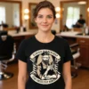 Woman wearing the Classic Barber Shop ladies t-shirt in black while standing in a barber shop