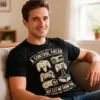 Man wearing the Control Freak men’s gaming t-shirt in black while sitting on a couch in a lounge room