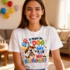 A woman wearing a white Dog Day Birthday t-shirt in a party lounge room