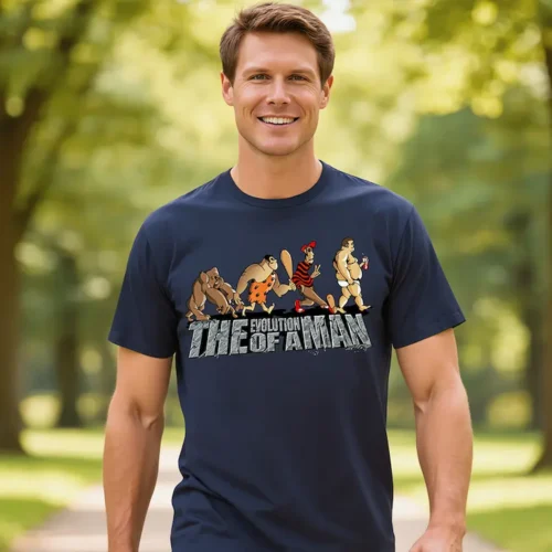 Man wearing the Evolution of a Man men’s t-shirt in navy while standing in a park
