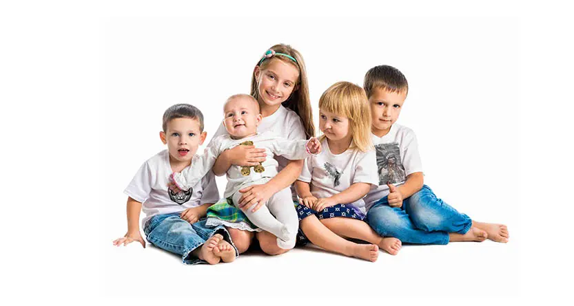 Children wearing custom printed white T shirts for a kids apparel blog post