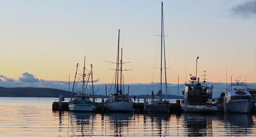 Hobart marina at sunset representing custom T shirt printing for Hobart customers
