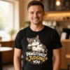 Man wearing a black Pawsitively Judging You men’s t-shirt in a coffee shop