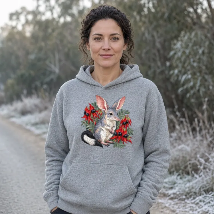 Lifestyle photo of the Bilby Among Sturt Desert Peas Hoodie being worn or used