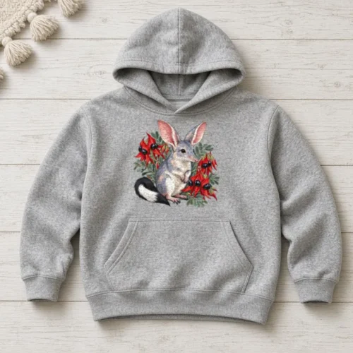 Grey marle Bilby Among Sturt Desert Peas kids hoodie laid flat on whitewashed timber boards