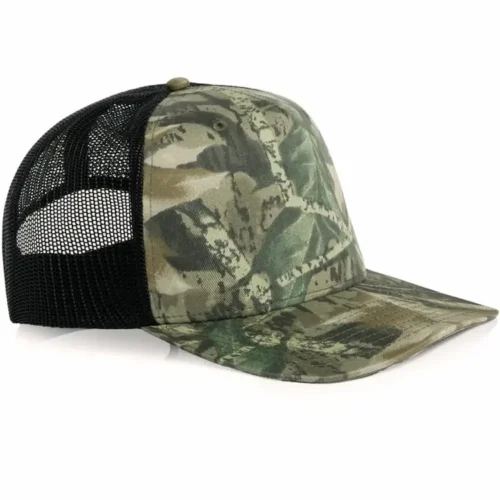 Angled side view of the AS Colour Stock Contrast Camo Trucker 1110C with a Tree Camo front and peak and black mesh back