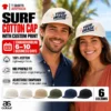 Couple wearing light-coloured caps with sample Your Design wave and palm graphics beside a palm-lined beach