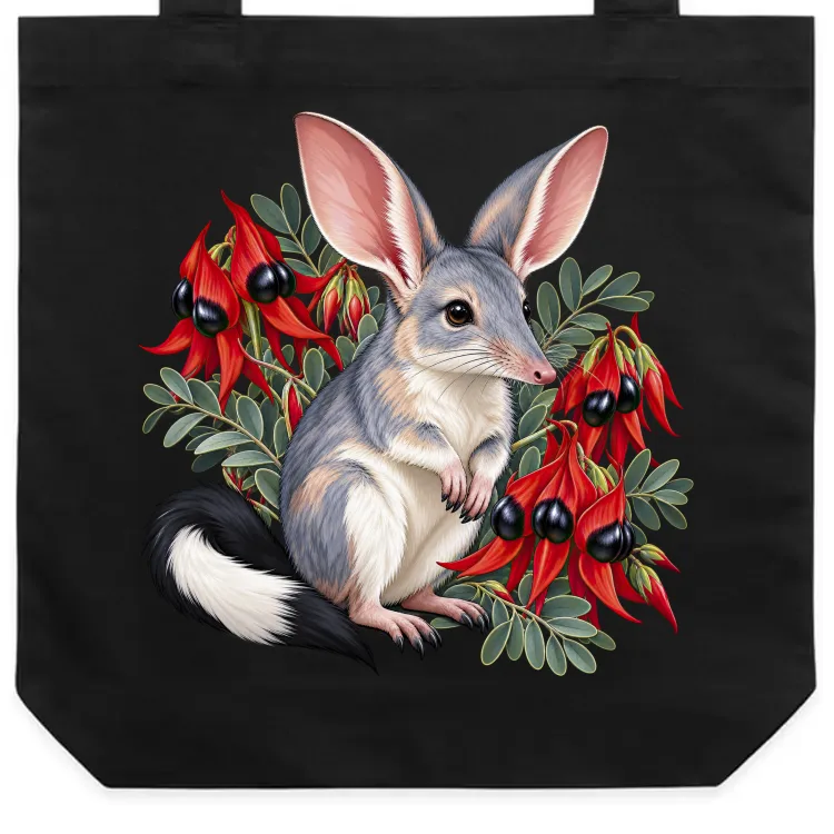 Black cotton tote bag with the Bilby Among Sturt Desert Peas print on the front