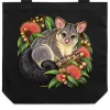 Black cotton tote bag printed with a brushtail possum among pink eucalyptus blossoms