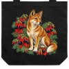 Black tote bag printed with a dingo among red Sturt’s desert pea flowers
